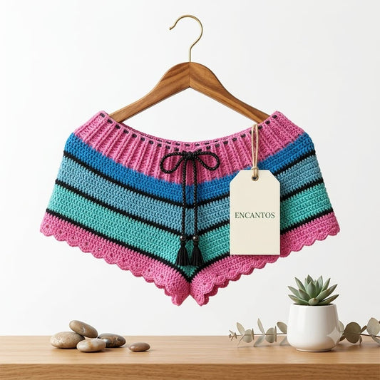 Short crochet multicolor rosa y turquesa con cordón negro en percha, etiqueta Encantos