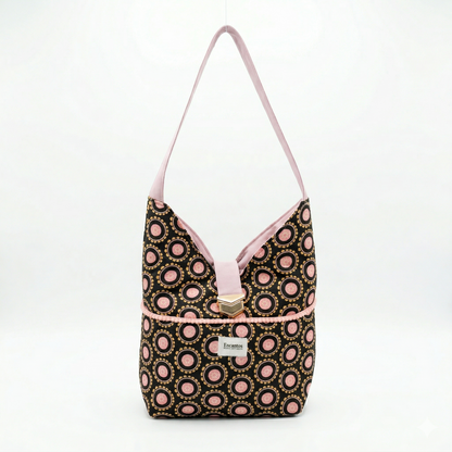 Bolso Hobo Círculos Rosa & Negro | Encantos con diseño de círculos rosa sobre fondo negro, con asa y detalles en rosa claro, estilo moderno y elegante.
