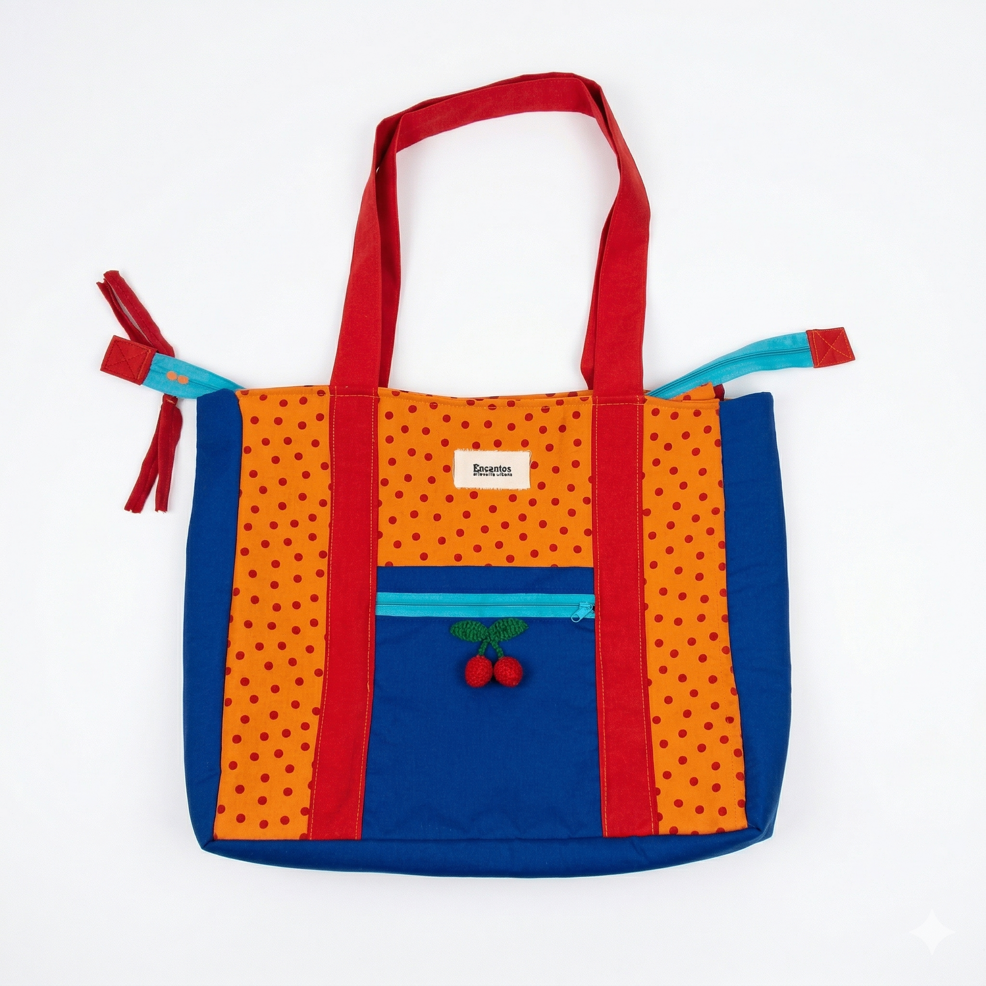 Bolsa Tote Cerezas — Encantos en colores naranja, azul y rojo con diseño de cerezas bordadas y detalles en lunares, ideal para uso diario y estilo casual.
