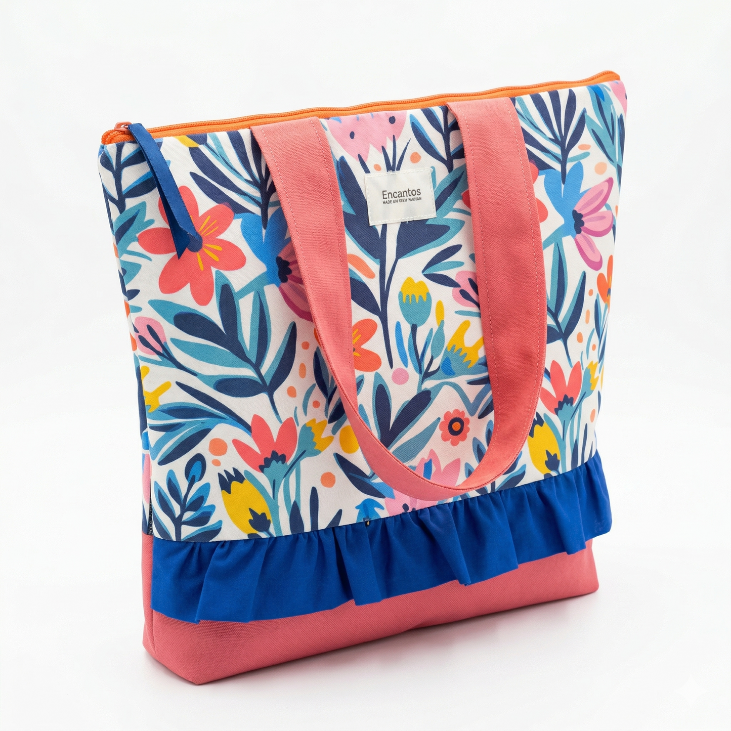 Bolso Tote Floral con Volante con estampado colorido de flores y hojas, asas rosas y detalle de volante azul, ideal para uso casual y diario.