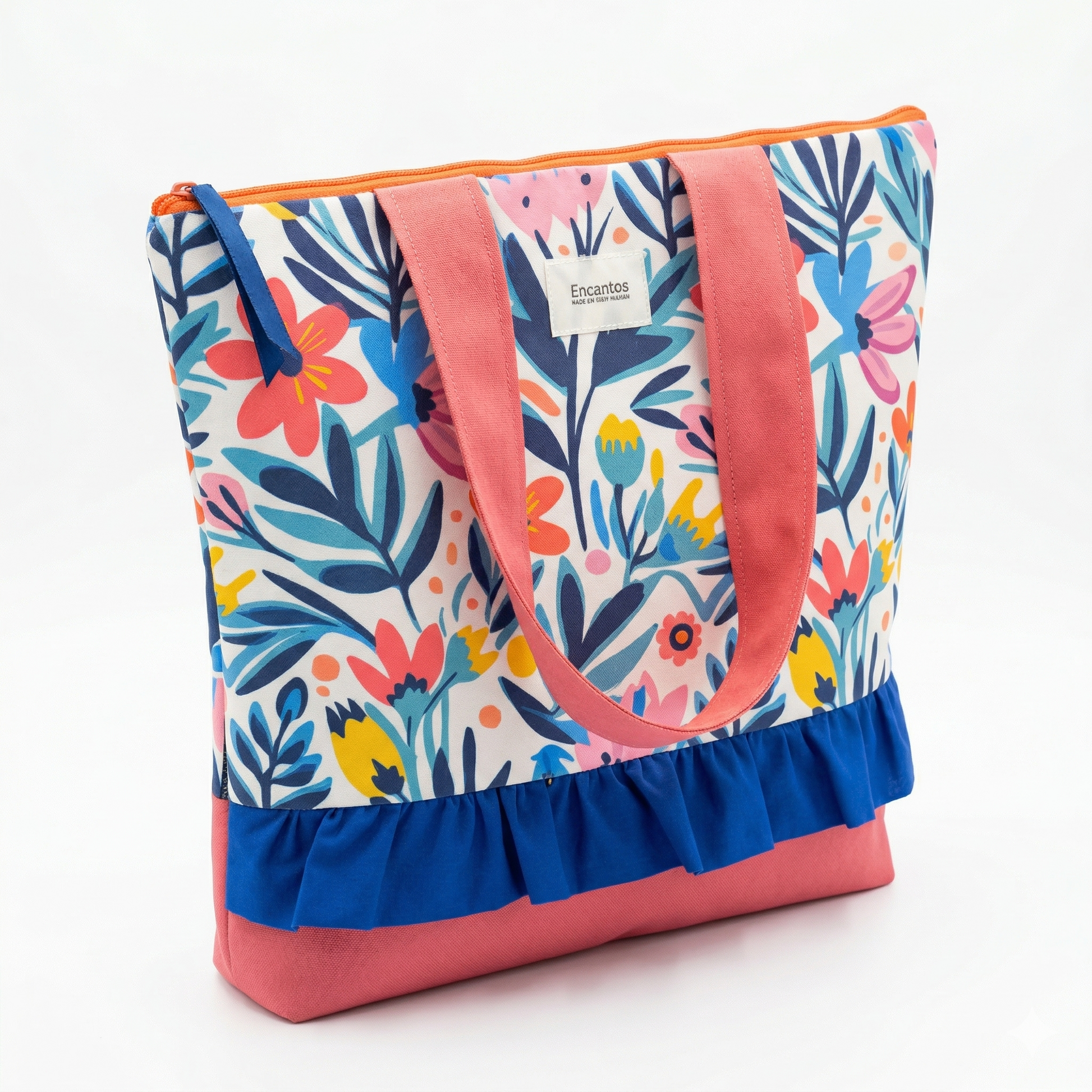 Bolso Tote Floral con Volante con estampado colorido de flores y hojas, asas rosas y detalle de volante azul, ideal para uso casual y diario.