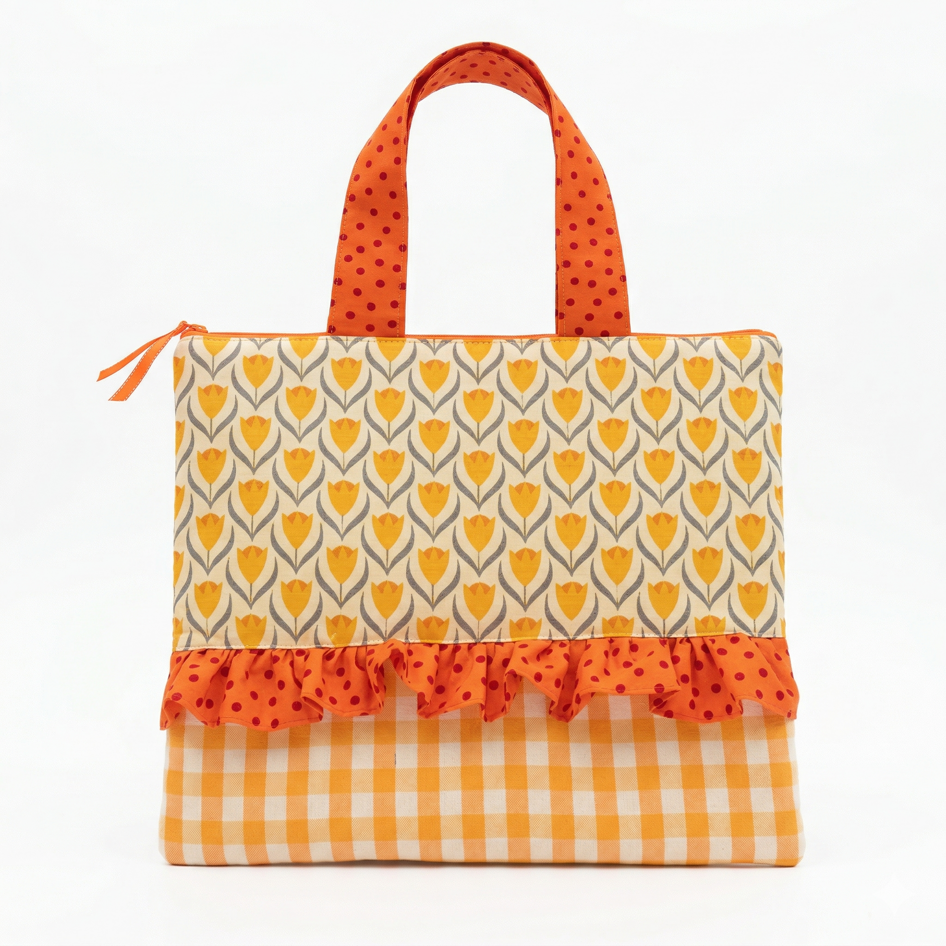 Bolso Tote Tulipanes con Volante de Lunares en tonos amarillos y naranjas, con diseño de tulipanes y detalle de volante con estampado de lunares.