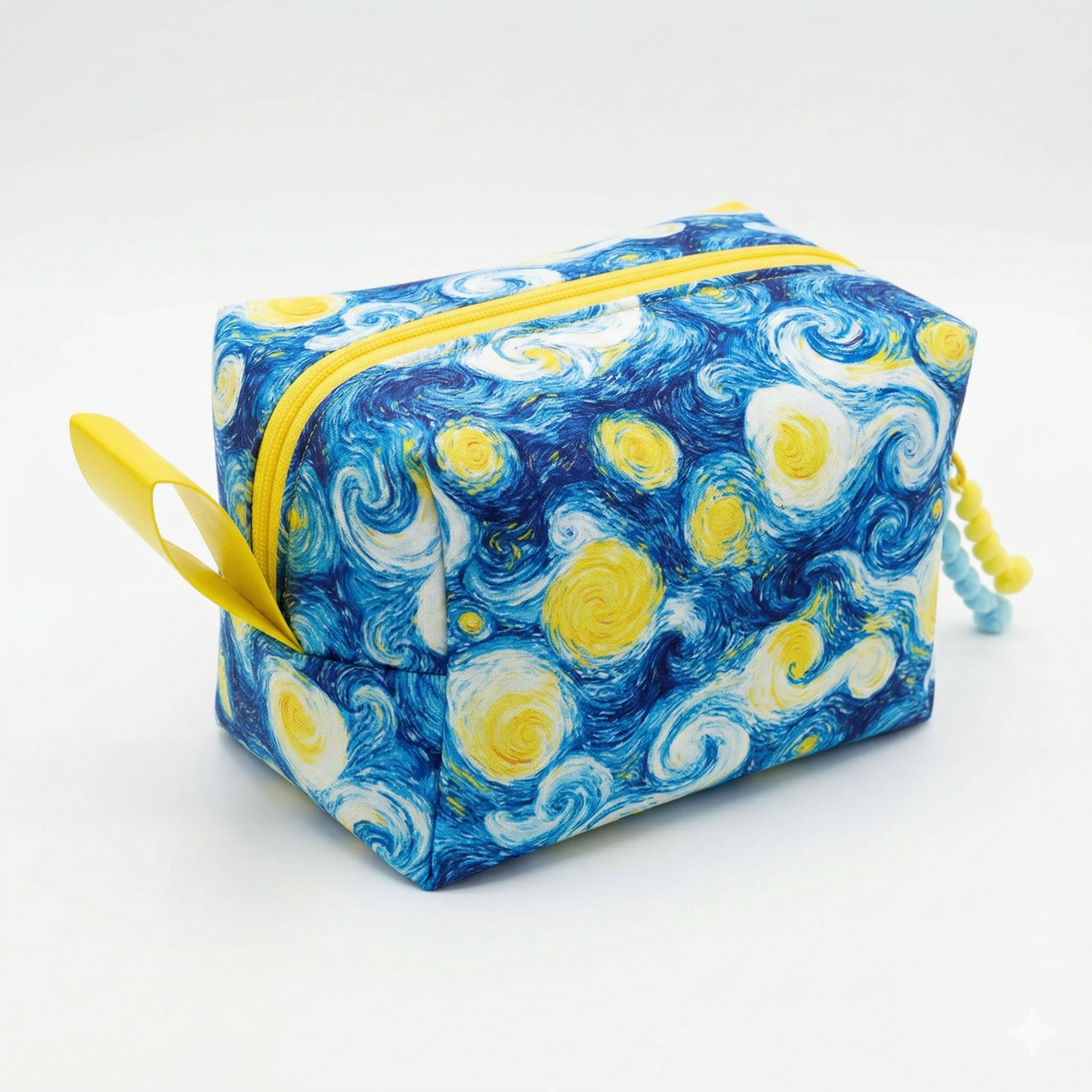 Neceser Noche Estrellada Van Gogh con diseño inspirado en la famosa pintura, con tonos azules y amarillos y cierre amarillo brillante.